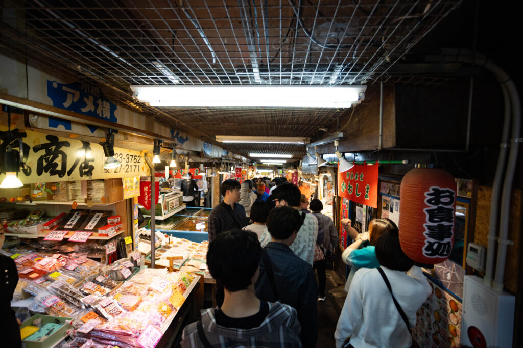 Walking through the narrow Otaru Sankaku Market